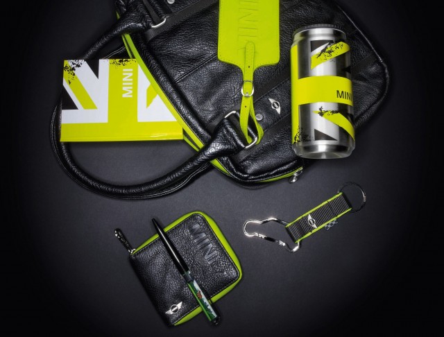 Image shows - MINI by PUMA Handbag £82, MINI by PUMA Wallet £32 and MINI Lifestyle Accessories - MINI Car Shaped Key Ring, MINI Thermos Can and MINI Notebook Set